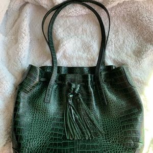 Green leather large multi-pocket handbag.